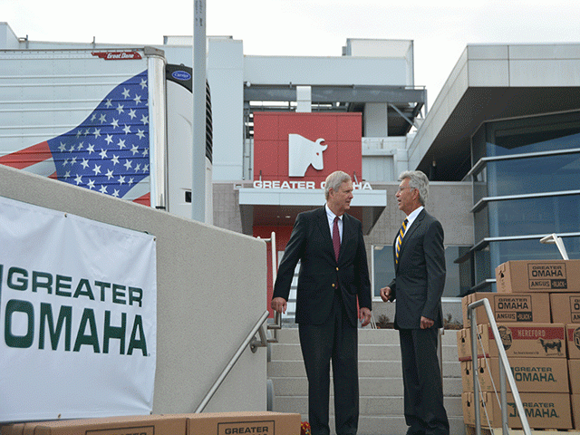 Agriculture Secretary Tom Vilsack, left, speaks with Henry Davis, owner and CEO of Greater Omaha Packing Co., before a press conference on Wednesday announcing a $19.9 million grant to the packing plant. (DTN photo by Chris Clayton) 