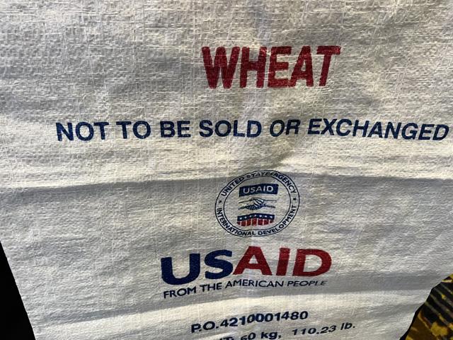A food aid bag displayed by the U.S. Agency for International Development (USAID) under the Food for Peace program. USAID buys about $2 billion a year in commodities, mainly small grains and pulse crops. A group of lawmakers want to move the Food for Peace program over to USDA to run. (DTN photo by Chris Clayton) 