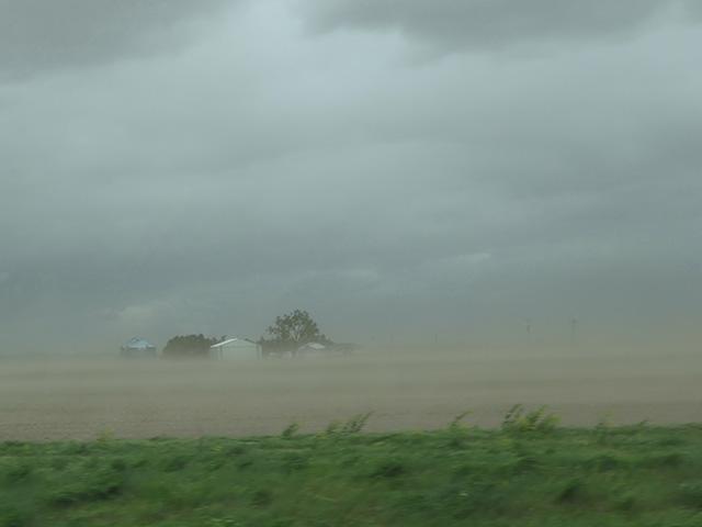 A unique set of weather conditions kicked up dust storms ahead of a line of strong thunderstorms in several parts of the Corn Belt. High winds with gusts up to near 60 mph on May 16 blew dust across fields near North Bend, Nebraska. (DTN photo by Elaine Shein) 