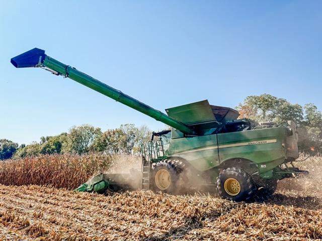 A farmer harvesting corn in northern Indiana earlier this fall. Collectively, corn farmers are projected to lose more than $15 billion on their crops this year, according to the American Farm Bureau Federation. While USDA is looking at an aid package, other groups point to previous ad-hoc funding and an improved safety net to question if payments are needed. (DTN photo by EllaMae Reiff)