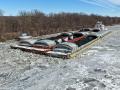 Ice on the Illinois River has been a problem for weeks. Barges have been unable to move, stuck in the ice. Pictured is a tow with barges recently stuck in the Marseille Canal. As of Feb. 4, four locks on the Illinois River have significant impacts caused by ice, according to the USACE Inland Waterway report. (Photo courtesy of the American Commercial Barge Line)