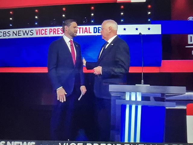 Ohio Sen. JD Vance and Minnesota Gov. Tim Walz talk just after the conclusion of Tuesday night&#039;s vice-presidential candidate&#039;s debate. They disagreed about a lot of policy topics, including climate change and the economy. (Photo from livestream) 