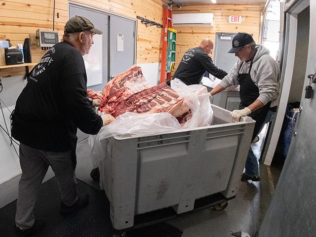 A butcher shop in Iowa wheels beef quarters from the weight room to cold storage for aging. Small processors are now eligible for USDA dollars because of historically tight U.S. cattle supplies. (Photo courtesy of USDA)