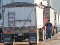 Farmers lined up to deliver grain to a facility in Kansas City, Missouri, in 2021. As farmers face record diesel prices this fall, commodity producers are also receiving record Agricultural Risk Coverage and Price Loss Coverage (ARC/PLC) payments. Farmers in some states benefit more than others. (DTN file photo by Jim Patrico)