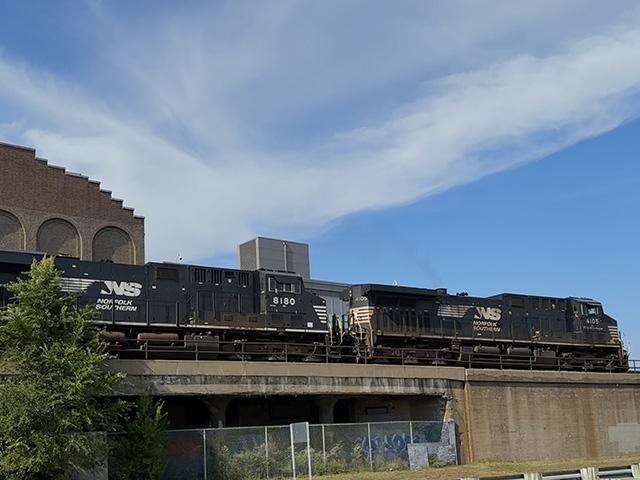 A Norfolk Southern train moves along the Mississippi River through downtown St. Paul, Minnesota. The Norfolk Southern and the Union Pacific railroads are proposing a merger, and disapproval is coming from U.S. rail-served companies. (DTN photo by Mary Kennedy)
