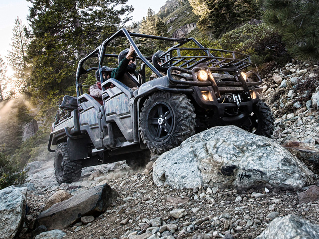 Riders wear helmets and sit within an Operator Protective Structure in this product photo of John Deere&#039;s XUV825i. 