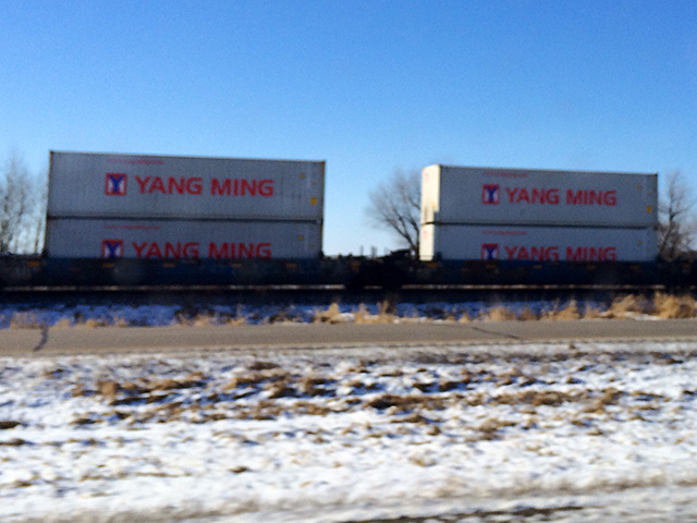 Loaded containers heading west by rail along the northern corridor in early January. (DTN photo by Mary Kennedy)