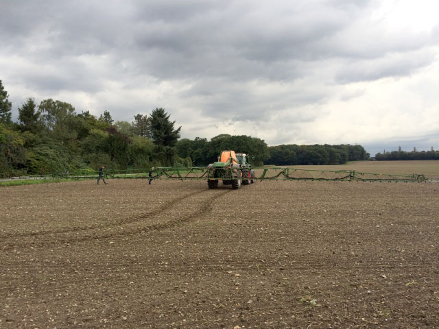 A crop sprayer lumbers across the landscape at Bayer&#039;s Laacher Hof concept farm near Monheim, Germany, to demonstrate how smart sprayers can target just areas where weeds escaped earlier treatments. (DTN photo by Pamela Smith)