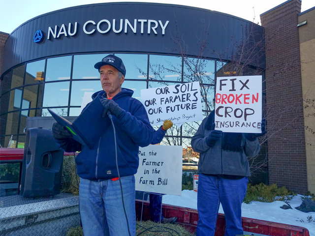 Randy Krzmarzick, a farmer from Sleepy Eye, Minn., speaks Monday on crop insurance reforms outside of NAU Country&#039;s headquarters in Minnesota. (courtesy photo) 