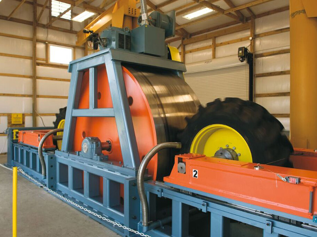 The drum test applies loads up to 50,000 pounds on tires, while exposing them to rubber-aging ozone to simulate damage from sunlight. (Photo courtesy of Firestone)