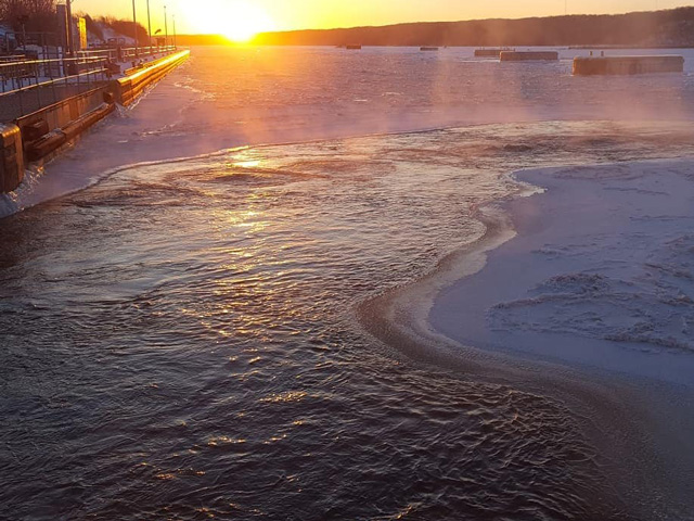 Crews working at Starved Rock Lock and Dam (pictured) near Ottawa, Illinois, "bubble" ice away from the lock and steam dam gates to keep them operational. At Dresden Island Lock and Dam near Morris, Illinois, crews crawl down inside the dam to steam and chip away built-up ice. This time consuming, but necessary, task allows the Corps to manage water levels on the Illinois Waterway for navigation purposes all winter long. (Photo by U.S. Army Corps of Engineers Rock Island District)