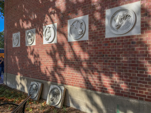 Five replicas of livestock-themed stone medallions now preside over the circa-1913 University of Illinois Stock Pavilion. Some originals are pictured below. (DTN photo by Pamela Smith)