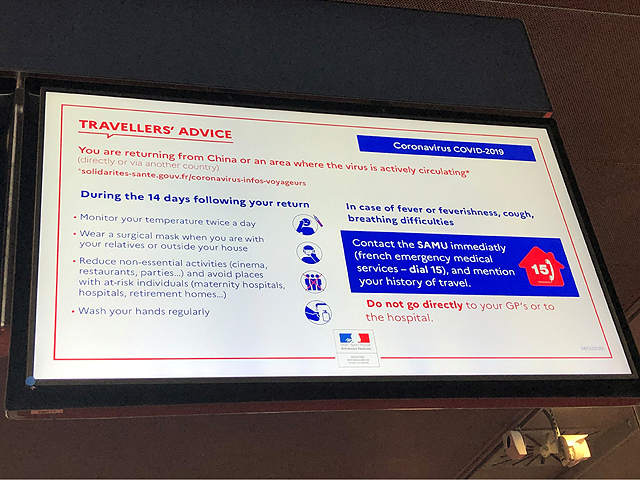 A sign in the Paris airport in early March cautioned travelers to watch for the signs of the coronavirus named COVID-19, especially if they are returning from China or other places where the virus is actively circulating. (DTN photo by Elaine Shein)