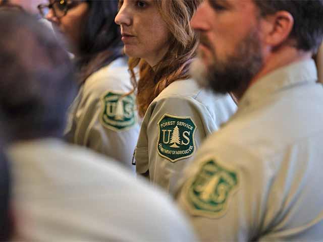 Forest Service employees attend an agency event in uniform. The Forest Service has faced some of the most significant relocation changes under USDA's reorganization, including the consolidation of offices and research sites. (Photo courtesy of USDA)