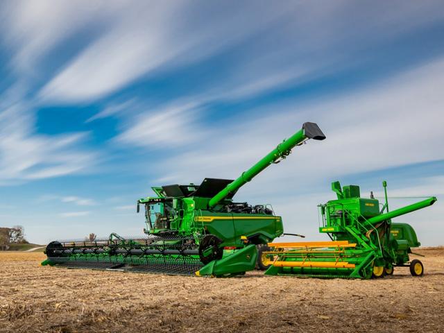 Celebrating 75 years of building self-propelled combines--first model and newest here--Deere announces new options for model year 2022 S Series Combines. (DTN photo courtesy of John Deere)