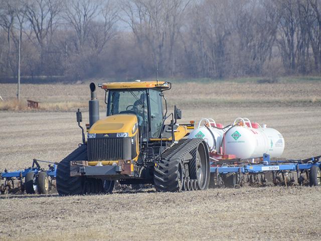 A farmer applied anhydrous ammonia to a field. Farm groups and Republicans in Congress have been pushing back against a proposed emissions reporting rule by the Securities and Exchange Commission (SEC). (DTN file photo by Elizabeth Williams)  