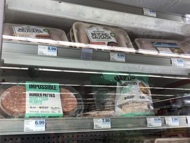During the pandemic, burgers and sausages from Impossible Foods and Beyond Meat appeared increasingly on supermarket meat shelves but now it&#039;s cooled down. (DTN photo by Elaine Shein)