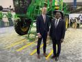 EPA Administrator Michael Regan, right, and Rod Snyder, EPA&#039;s agricultural advisor, pose in front of a John Deere sprayer on the expo floor of Commodity Classic. Regan created a new Agriculture and Rural Affairs office that Snyder will lead. (DTN photo by Jerry Hagstrom) 