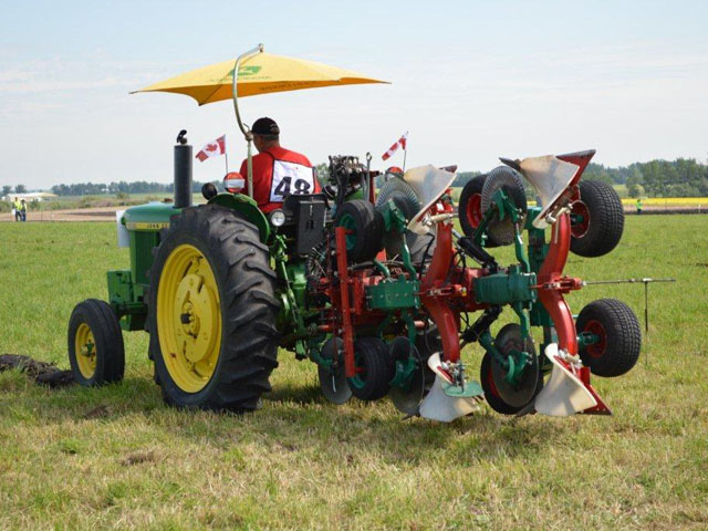 And they&#039;rrrrre off! One of the two Canadian competitors lines up for his first pass in the reversible plow category at the World Plowing Championships at Olds College in Olds, Alberta on July 19-20. (DTN photo by Cliff Jamieson)