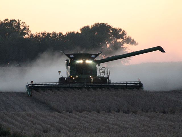 Troy Kontz combines soybeans near Brookings, South Dakota. (DTN photo by Elaine Shein)