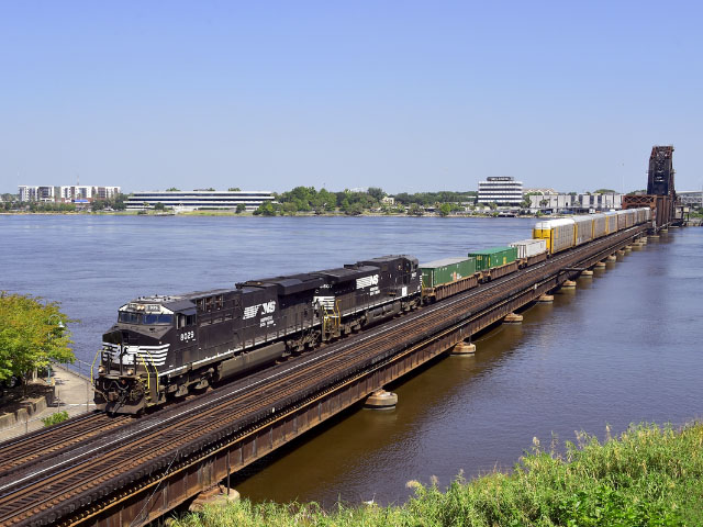 A Norfolk Southern train crosses the St. Johns River in Jacksonville, Florida. Norfolk Southern is now in recovery mode from the damage left behind by Hurricane Irma. The company is working nonstop with customers to identify switching needs and service plans as recovery progresses. (Photo courtesy of Norfolk Southern)