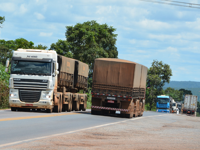 Trucks, mostly hauling soybeans from the recent harvest, roll on highway BR 364, one of the best-maintained roads connecting west-central Mato Grosso farm areas to the state capital, Cuiaba, and meandering farther southeast toward the rail line in Rondonopolis or the Santos Port at Sao Paulo, Brazil, which is 1,800 kilometers (1,118 miles) away. (DTN photo by Chris Clayton)