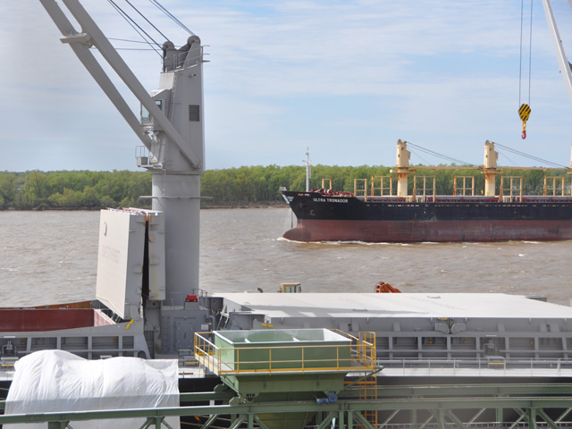 A ship passes another ship at port along the Parana River near Rosario, Argentina. (DTN Photo by Chris Clayton)