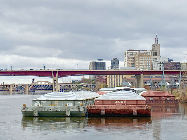 Barges waiting in downtown St. Paul in early November were eventually moved south ahead of the winter closure, many of them still empty. (Photo by Mary Kennedy)