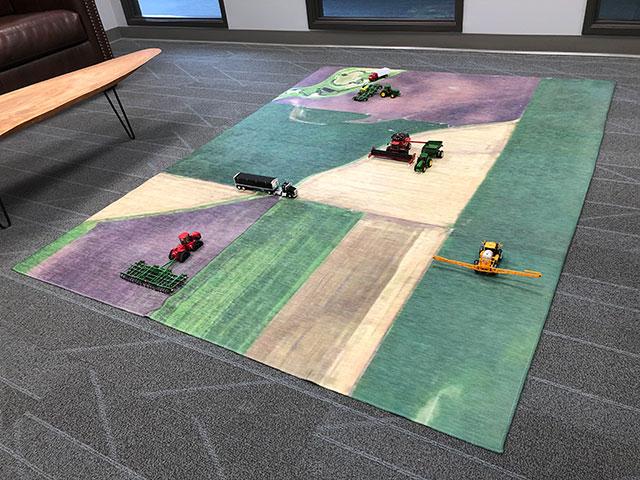 Carpet farming just grew up. Kids will clamor to put in long hours of farm play with rugs that can be customized to reflect real farmsteads. (Photo courtesy of Nathan Faleide)