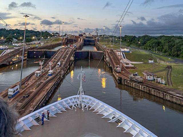 Pictured is a Viking cruise ship entering the Panama Canal recently. It took about nine hours to transit the lock from the Atlantic Ocean to the Pacific Ocean, with normal transit on average approximately 8 to 10 hours. On the sides are the "mules," small electric locomotives that help center ships in the locks. (Photo by Rosemary Acker Radant)