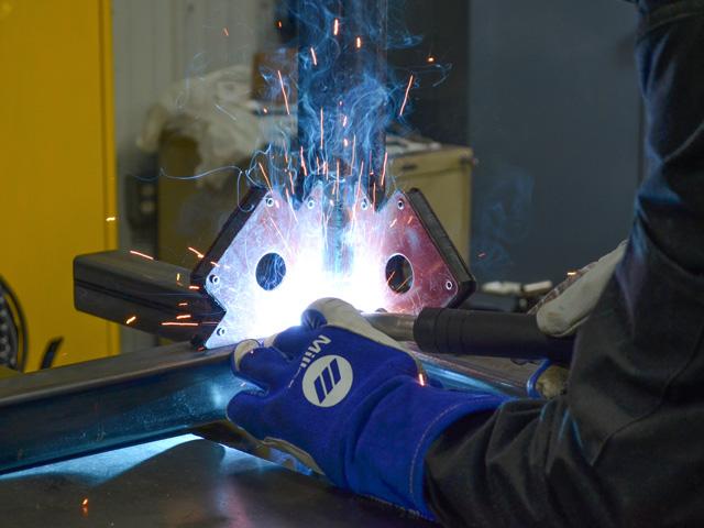 Welding is a common practice that requires special care around paint and batteries. (DTN photo by Dan Miller)
