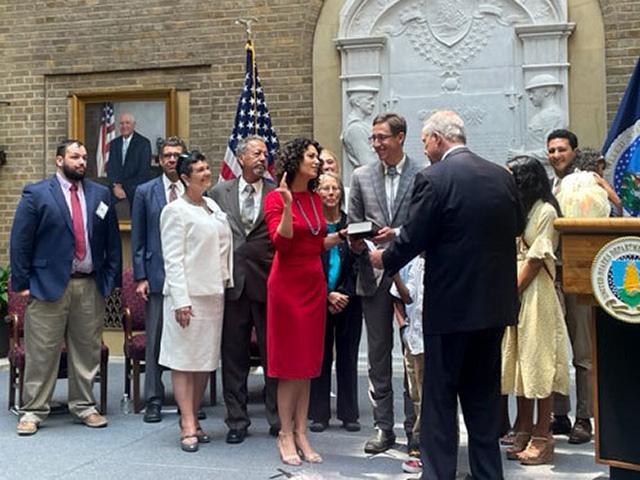 Agriculture Secretary Tom Vilsack swears in Xochitl Torres Small as Agriculture deputy secretary. Torres Small&#039;s husband, Nathan, is on her right and her parents are standing to her left. Other family members are behind her. (DTN photo by Jerry Hagstrom)