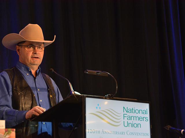 Zach Ducheneaux, administrator for the Farm Service Agency, speaking earlier this year at the National Farmers Union annual meeting. At an event this week in Minnesota, Ducheneaux talked about disaster aid, CRP acres and challenges with local FSA offices. (DTN file photo) 