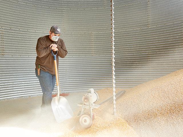 A sweep auger can be a useful tool to clean out bins, but it is also dangerous and can lead to a farm accident in a split second. (DTN/Progressive Farmer file photo by Hal Maggiore)