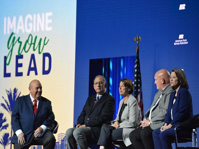 Zippy Duvall, president of the American Farm Bureau Federation, interviews the chairmen and ranking members of the U.S. House and Senate agriculture committees at AFBF's annual meeting on Sunday. While the farm bill was discussed, the lawmakers put more emphasis on the need to address farm labor and immigration. (DTN photo by Chris Clayton) 