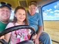 Joel Reichenberger, left, daughter Lydia and Grandpa Larry crowd in the cab during the 2025 wheat harvest. (Joel Reichenberger)