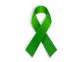 A green ribbon is an international symbol of mental health awareness. (marigold_88, iStock, Getty Images)