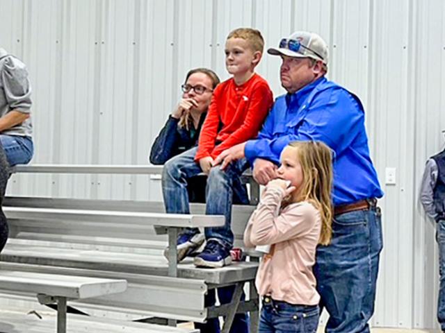 Tiffany and her family at a show animal auction (Courtesy of Tiffany Dowell Lashmet)