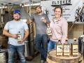 Joe Knobbe (left), Devon Birchem and Kylie Kai were high school and college friends before joining forces in Flyover Whiskey, near their hometown of West Point, Nebraska. (Joel Reichenberger)