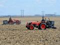 A Kubota tractor autonomously operated by Sabanto plants soybeans while another goes to the seed tender.
(Progressive Farmer image by Matthew Wilde)
