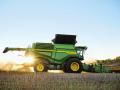 The John Deere X9 Combine with BP15 Belt Pickup harvests canola. (Progressive Farmer image by John Deere)