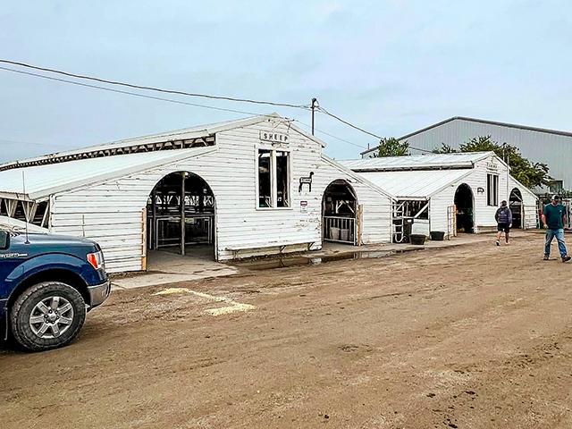 For generations, two identical wood buildings housed hog and sheep projects during the 107-year run of the eastern Nebraska fair. A new livestock building will replace these old buildings in 2027. (Russ Quinn)