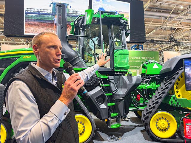 John Deere Senior Vice President and Chief Technology Officer Jahmy Hindman points out the features on one of the company&#039;s tractors that&#039;s equipped for autonomous tillage. (DTN/Progressive Farmer photo by Joel Reichenberger)