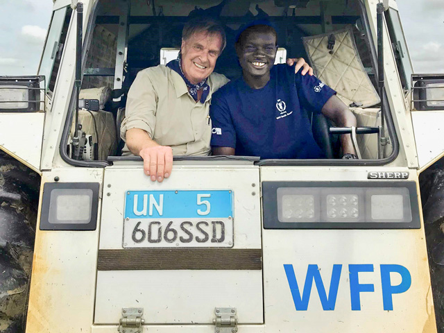 Ambassador Kip Tom works with a representative of the United Nations World Food Programme. (Photo courtesy of Kip Tom)