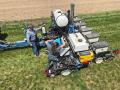 AgroLiquid employees Tim Duckert and Micalah Blohm work on and fill a planter at the company&#039;s North Central Research Station in St. Johns, Michigan. (Progressive Farmer image provided by AgroLiquid)