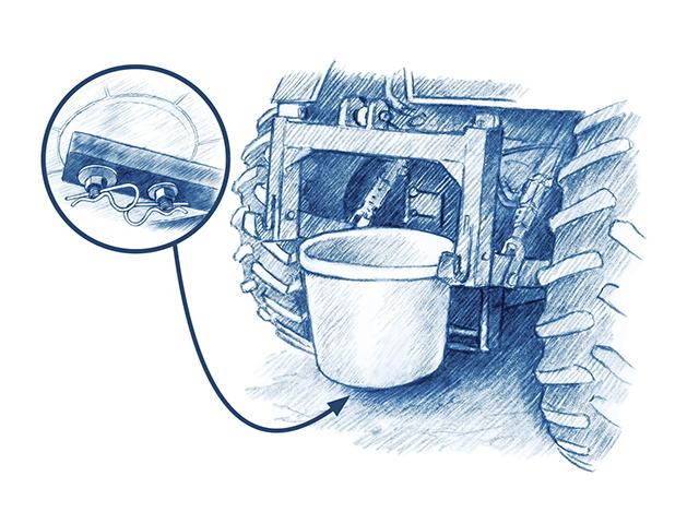 An old lick tub can be reused as a container attached to a tractor. (Ray E. Watkins Jr.)