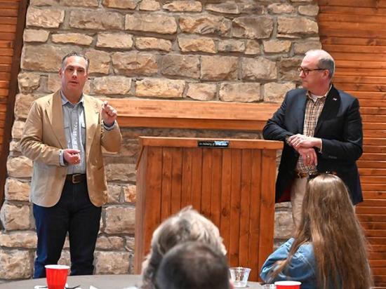National Cattlemen's Beef Association Senior Vice President of Government Affairs Ethan Lane and NCBA CEO Colin Woodall discuss the Grazing Action Plan and other important topics during a producer meeting in Nevada, Iowa. (DTN/Progressive Farmer photo by Jennifer Carrico)