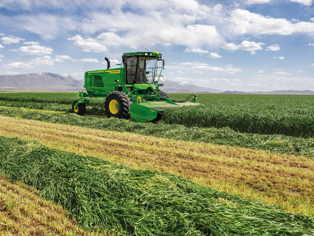 Operators electronically adjust windrow formation from the cab to optimize cutting and speed dry down. (Photo courtesy of John Deere)