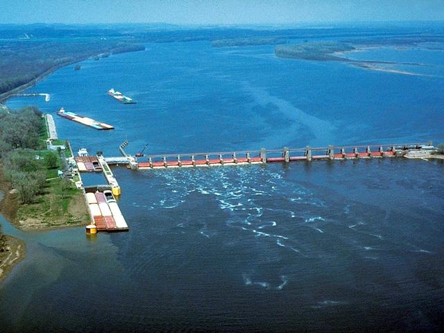 Lock and Dam 25 is a 1,296-foot-long dam structure with three submersible roller gates and 14 submersible tainter gates. At the time of construction, the submersible gates represented a marked advance in gate design and were seen as an improvement over non-submersible gates because they allowed for the almost unobstructed flow of floodwaters, ice and debris, according to USACE. However, having opened on May 18, 1939, Lock and Dam 25 is well beyond its 50-year design life. (Photo courtesy of USACE)