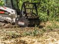 Bobcat is launching new Brushcat rotary cutter attachments and redesigned loader drum mulchers for land clearing work. Show here is the loader drum mulcher. (Photo courtesy of Bobcat)